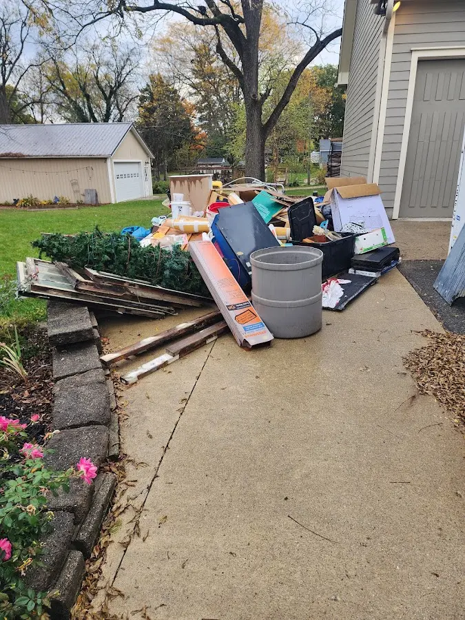 Dumpster being loaded with debris for Demolition Dumpster Rental in Elkridge